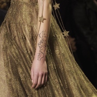 Fineline Mushu tattoo